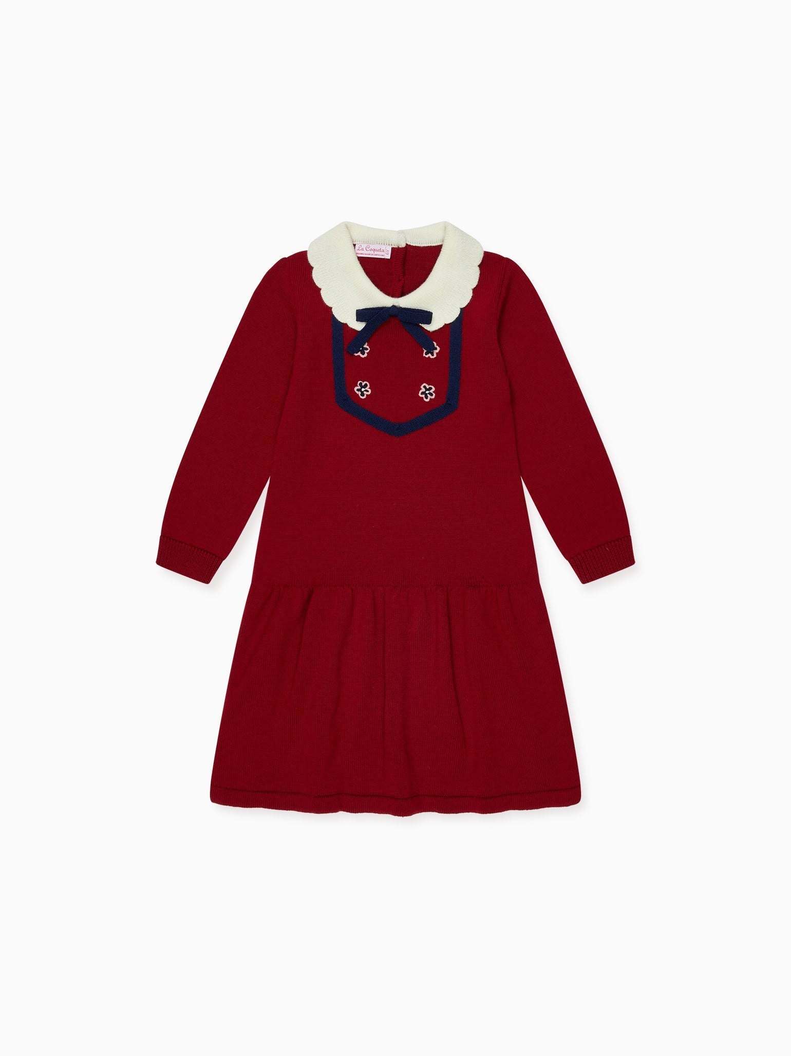 A charming children's red knit dress with an ivory scalloped collar, navy bow, and embroidered floral details perfect for special occasions.