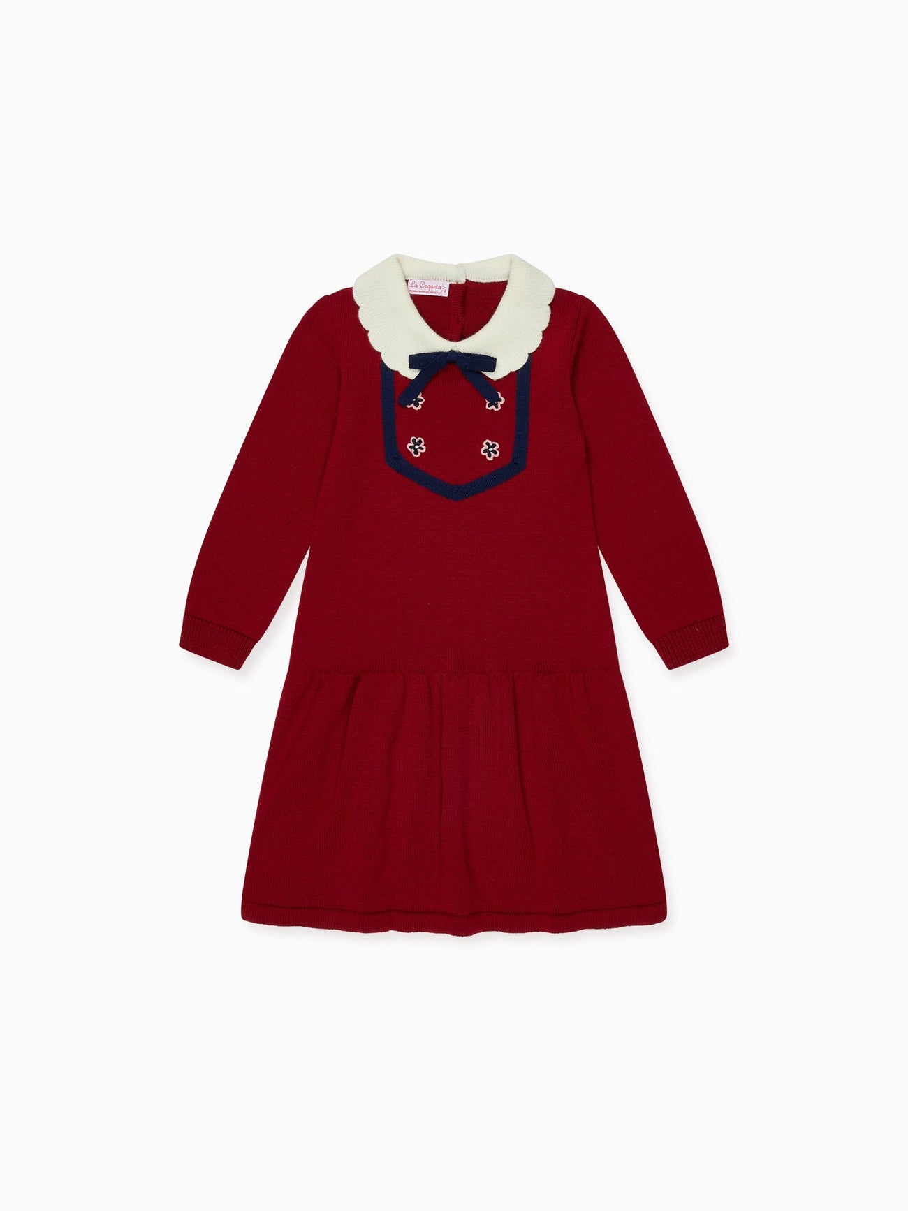A charming children's red knit dress with an ivory scalloped collar, navy bow, and embroidered floral details perfect for special occasions.